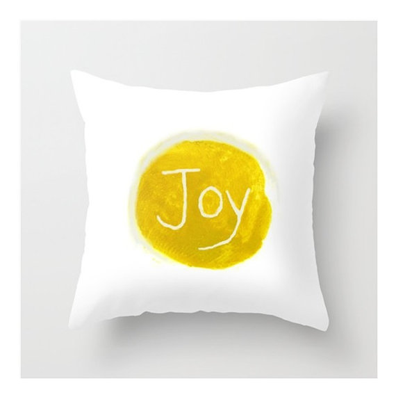 {Joy pillow cover by LovesParisStudio} 